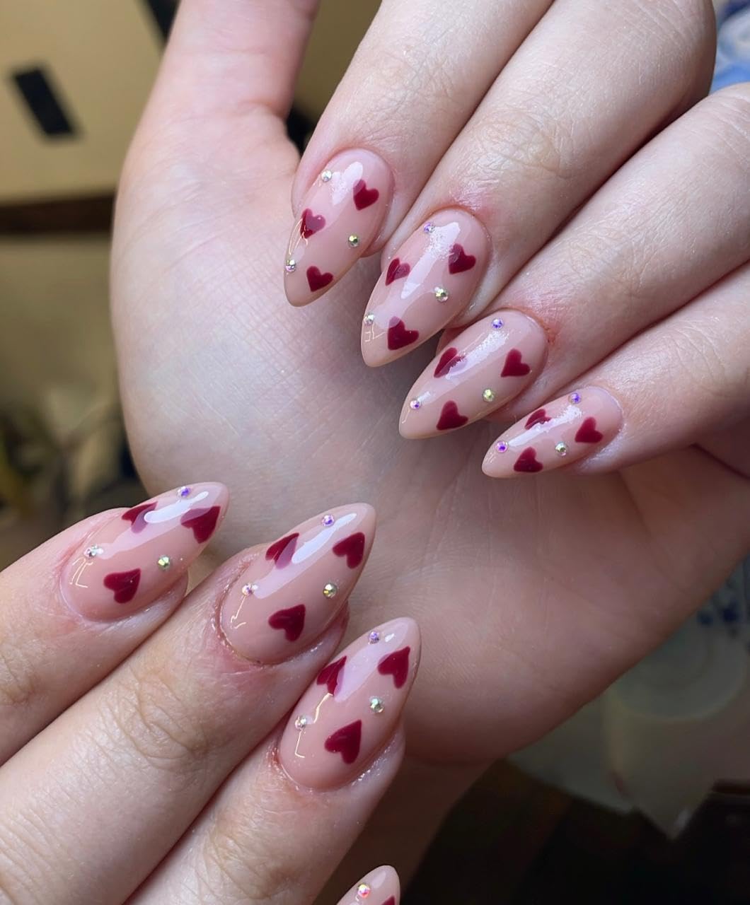 Tiny red hearts, hand-painted nail art